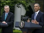  President Obama, accompanied by Turkish Prime Minister Recep Tayyip Erdogan gestures during their joint news conference, today at the White House in Washington.