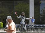  Sammy Adebiyi, of West Toledo, center, cheers after receiving his citizenship papers during a Naturalization Ceremony.