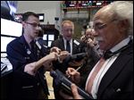  FILE - Specialist Bradley Kessler, left, works with traders on the floor of the New York Stock Exchange in this May 7, 2013 file photo. Financial markets were subdued Thursday May 16, 2013 despite encouraging growth figures out of Japan, as investors paused for breath a day after the main U.S. stock indexes struck record highs. (AP Photo/Richard Drew, File)