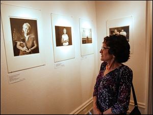 Vicki Marsh, of Maumee, takes a look at several pieces by photographer Matika Wilbur.