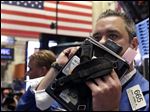  FILE - In this Thursday, May 2, 2013, file photo, Trader Kevin Lodewick works on the floor of the New York Stock Exchange. World stock markets were mixed Friday May 17, 2013 as investors digested a slew of disappointing data from the U.S. ahead of the release of a key measurement of the country's economic outlook.  (AP Photo/Richard Drew)