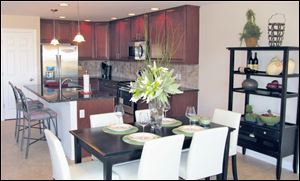 This lovely island kitchen is open to the dining area. Both are open to the great room.