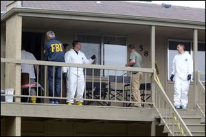 Federal authorities search an apartment in Boise, Idaho on Cassia Drive on Thursday afternoon. U.S. authorities in Idaho said they have arrested a man from Uzbekistan accused of conspiring with a designated terrorist organization in his home country and helping scheme to use a weapon of mass destruction. 