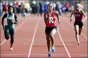 Sasha Dailey of Rogers cruises in the 100 meters. She also won in the 200 and led two relay teams to victory for the Rams.