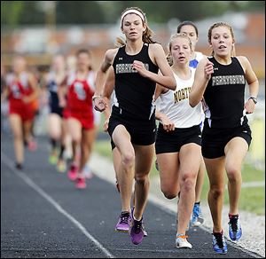Courtney Clody, left, and Taylor Monheim, both of Perrysburg, finished first and and second, respectively in the 1600 meters. Clody also won the 800.