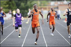 J.J. Pinckey of Southview wins the 400-meter race. He also set an Northern Lakes League meet record with a long jump of 22-7, anchored the 1600 relay team to a victory, and finished second in the 200.