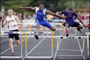 Ose Omofoma of Anthony Wayne leads Adam Downing, left, of Northview and Andre Johnson of Maumee on his way to winning the 300-meter hurdles at the NLL meet.