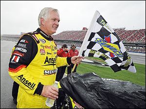 Frank Kimmel celebrates on pit road after winning the rain-shortened ARCA Series race May 3 at the Talladega Superspeedway.