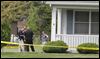 State and local authorities investigate a fatal shooting and home invasion on South River Road in Waterville Township.