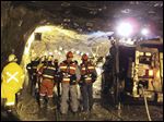  In this photo taken and released by PT Freeport Indonesia  Friday, the Indonesian unit of Arizona-based Freeport-McMoRan Copper & Gold Inc, rescuers gather inside a tunnel that collapsed on Tuesday morning as they continue their attempt to rescue trapped workers at Big Gossan mining area in Mimika, Papua province, Indonesia. 
