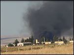  This citizen journalism image provided by Edlib News Network, ENN, which has been authenticated based on its contents and other AP reporting, shows black smoke rising from what rebels say is a helicopter that was shot down at Abu Dhour military airbase which is besieged by the rebels, in the northern province city of Idlib, Syria, Friday May 17, 2013. Rights activists have found torture devices and other evidence of abuse in government prisons in the first Syrian city to fall to the rebels, Human Rights Watch said in a report Friday. (AP Photo/Edlib News Network ENN)