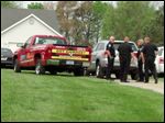  Police assembled at the home believed to be site of shooting in Waterville Township.