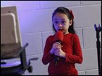  Anabelle Nagy, 6, sang Friday evening during a live karaoke night at Zoar Lutheran Church in Perrysburg.