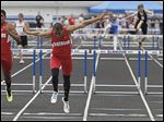  Eastwood’s Devin Snowden beats teammate Joey Salinas in a 300-meter hurdles heat. Snowden won the final and also captured the long jump and ran on two winning relay teams at the Northern Buckeye Conference meet.