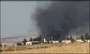 This citizen journalism image provided by Edlib News Network, ENN, which has been authenticated based on its contents and other AP reporting, shows black smoke rising from what rebels say is a helicopter that was shot down at Abu Dhour military airbase which is besieged by the rebels, in the northern province city of Idlib, Syria, Friday May 17, 2013. Rights activists have found torture devices and other evidence of abuse in government prisons in the first Syrian city to fall to the rebels, Human Rights Watch said in a report Friday. (AP Photo/Edlib News Network ENN)