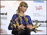  Taylor Swift poses backstage with her awards at the Billboard Music Awards at the MGM Grand Garden Arena on Sunday in Las Vegas. Swift won eight of 11 awards, including top artist and top Billboard 200 album for “Red.” She told the crowd: “You are the longest and best relationship I ever had.”