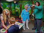  Harriet Loar, left, gets a guided tour of the new Harriet Loar Early Literacy Center from Children’s Librarian Martie Yunker at the Evergreen Community Library in Metamora, Ohio. The educational center will be open during library hours, except for the story-time hour on Wednesdays.