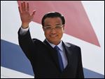  Chinese Premiere Li Keqiang waves as he arrives in New Delhi, India, today.