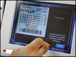  A clerk dispenses a Powerball Lottery ticket in Oklahoma City, Friday, May 17, 2013. Powerball officials say the jackpot has climbed to an estimated $600 million, making it the largest prize in the game's history and the world's second largest lottery prize.(AP Photo/Sue Ogrocki)