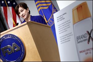 Janet Woodcock, director of the FDA's Center for Drug Evaluation and Research, speaks during a 2011 news conference about the rules for sunscreen labeling. The rules from the Food and Drug Administration ban terms like “waterproof,” which regulators consider misleading, and require that sunscreens filter out both ultraviolet A and B rays. Previously some products only blocked UVB rays, which cause most sunburn, while providing little protection against UVA rays that pose the greatest risk of skin cancer and wrinkles.