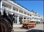  Mackinac Island’s newest hotel, the Bicycle Street Inn& Suites on Main Street, is opposite Shepler’s dock. The resort island between lakes Huron and Michigan that bans cars and yet draws close to a million visitors each year is facing key decisions on what development to allow to accommodate the tourist business that keeps it alive. 