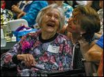  Bowling Green Manor resident Fern Sipe, 101, shares a laugh with Jackie Metz, volunteer coordinator for the Wood County Committee on Aging, at the 90 Plus Spectacular in Bowling Green.