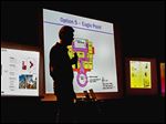  John Appt, chairman of the Master Plan Steering Committee, presents the five options for renovating or replacing Rossford’s school buildings during a forum Wednesday at the high school auditorium.