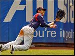  Mud Hens right fielder Ben Guez makes a diving catch of a sacrifice fly hit by  Syracuse Chiefs first baseman Chris Marrero in the 10th inning which allowed Jeff Kobernus to score from third base.