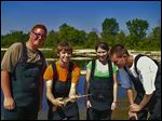  Alex Kocher (Bowsher) holds a longnose gar that he and fellow Wildlife Management students Will Gilbert III (Waite), left, Leigha Kelley (Waite), and Tres' Black (Start) netted during field work on the Maumee River.
