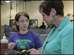  Sophomore Jessica Magrum talks to Fran Lawrence, executive vice president of the American Federation of Teachers. Leaders of the AFT, the Ohio Federation of Teachers, and a representative of U.S. Sen. Sherrod Brown toured the west end Toledo Technology Academy on Monday.