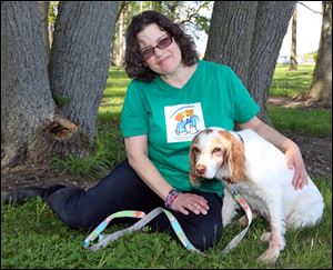 Jody Brickner of Findlay  with Ruthie. Mrs. Brickner was fostering Ruthie and ended up keeping the 15-year-old  Brittany spaniel after the dog recovered from heartworm disease.