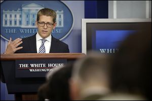 White House Press Secretary Jay Carney gestures as he speaks during his daily news briefing at the White House in Washington.