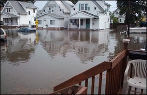 A pub owner and 28 others assert that negligence by city contractors doing a sewer repair caused the flooding in their West Toledo neighborhood in August, 2011. An attorney representing them said damage amounted to between $500,000 and $750,000.