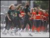  Clay players run off the field in celebration after defeating Southview in a Division I district semifinal softball game at Rolf Park in Maumee. 