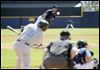  Syracuse's Chris Rahl makes contact on a pitch from Mud Hens starter Derek Hankins.