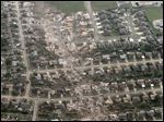  This aerial photo shows the remains of homes hit by a massive tornado in Moore, Okla., Monday.