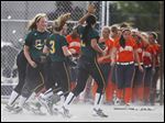  Clay players run off the field in celebration after defeating Southview in a Division I district semifinal softball game at Rolf Park in Maumee. 