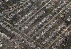 An aerial view of an entire neighborhood in Moore, Okla., illustrates the severity of Monday's tornado. The twister roared through the Oklahoma City suburb on a 20-mile path of destruction.