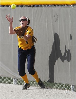 Notre Dame's Sarah Long attempts to make a catch on a hit by a Springfield player.