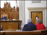  Judge Michael A. Borer speaks to Michael Aaron Fay and his attorney William Kluge in Juvenile Court on Tuesday in connection to aggravated murder at the Putnam County Courthouse in Ottawa.