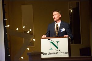 Rex Stump accepts an award on behalf of the Fellowship of Christian Athletes.