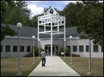  A student walks into the Whitman Center at Monroe County Community College.