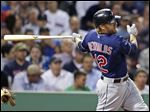  Cleveland Indians' Mark Reynolds follows through on a two-run single during the third inning of a baseball game against the Boston Red Sox at Fenway Park in Boston, Thursday, May 23, 2013. (AP Photo/Charles Krupa)