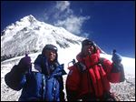  80-year-old Japanese extreme skier Yuichiro Miura, right, and his son, Gota pose at their South Col camp at 26,247 feet before their departure for Camp 5 during their attempt to scale the summit of Mount Everest.