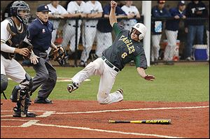 Clay’s Ty McAtee scores as St. John’s catcher Corey Tipton waits for the ball during the second inning of the Division I district semifinals at Mercy Field on Thursday. The Eagles won 5-0.