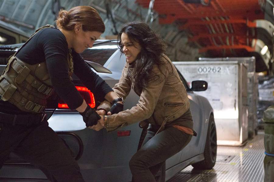 Gina-Carano-left-and-Michelle-Rodriguez-in-a-scene-from-Fast-Furious-6