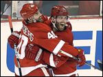  The Red Wings' Daniel Cleary, right, celebrates his empty-net goal with teammate Henrik Zetterberg. The veteran right wing said his team feels good with a 3-1 series lead.