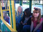  From right to left is Ava Hess, Layla Kajfasz, and Ava Lewis who are all riding the train during the Perrysburg Alternative to Substance Abuse event in downtown Perrysburg Friday.