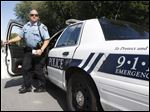  Officer Jamie Brown at the scene of a burglary.