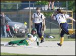  Hayley Schiavone scores for Clay in the second inning against Notre Dame  catcher Emily Novak in a Division I district final.